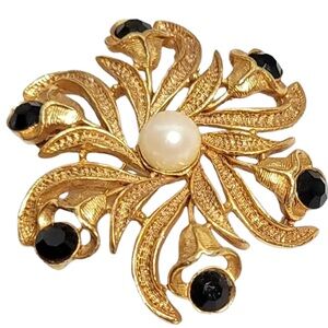 Elegant Gold and Black Floral Brooch